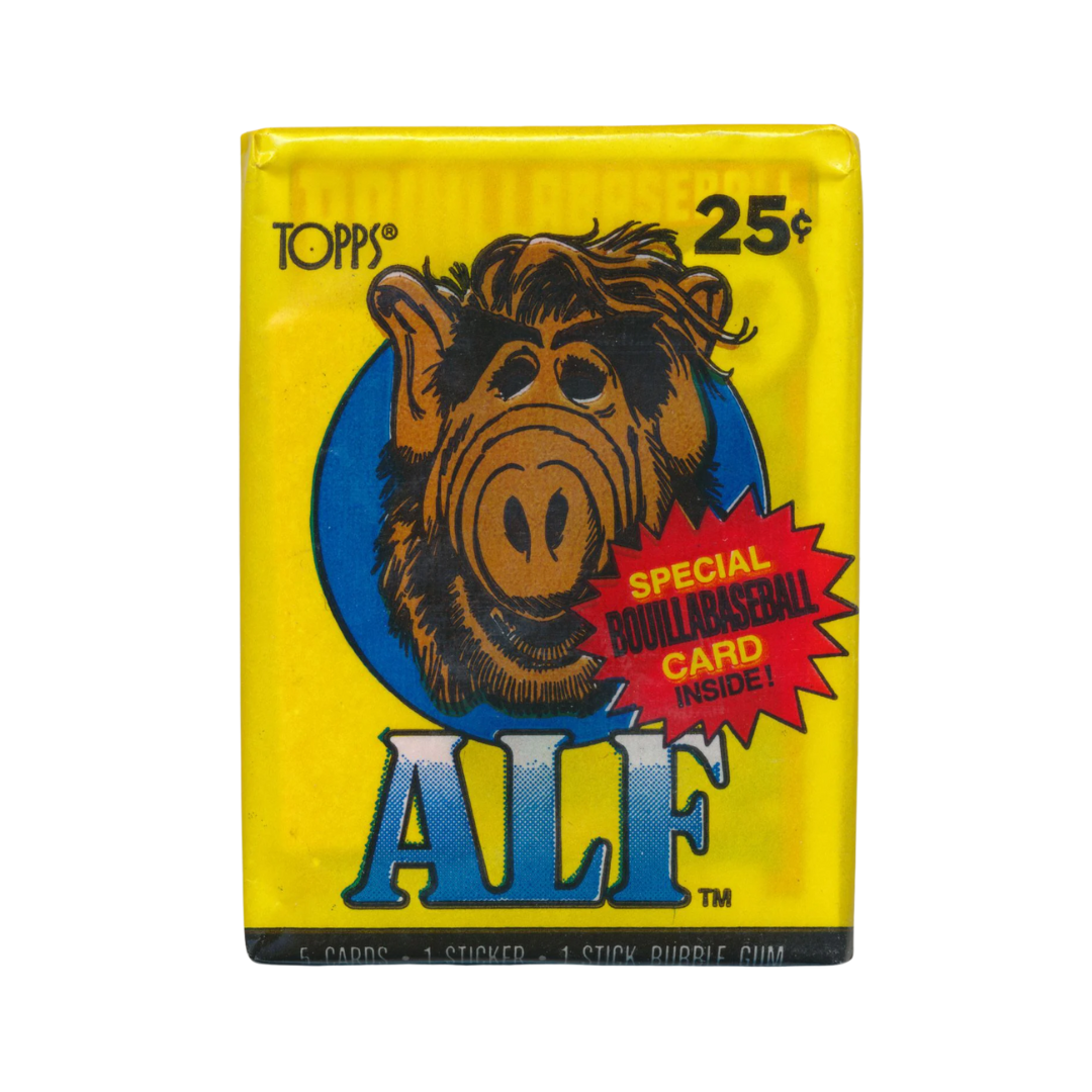 Vintage Topps Alf trading card pack with character illustration and text on a yellow background