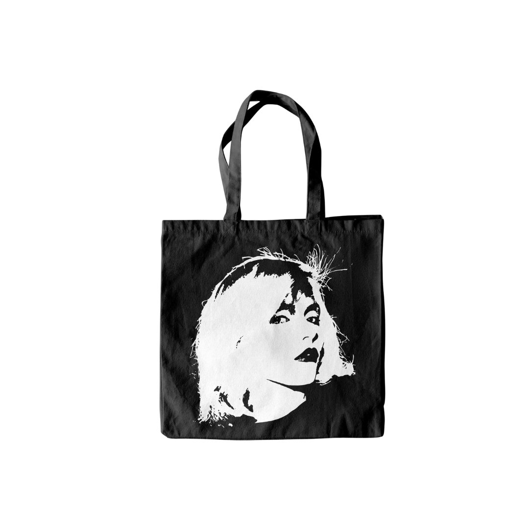 Black tote bag with a white graphic of a face on a white background