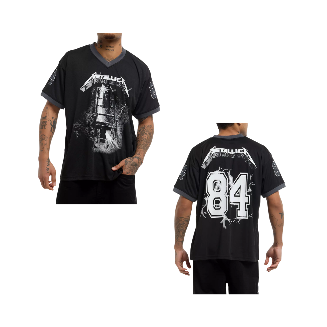 Black t-shirt with graphic design worn by a person on a white background