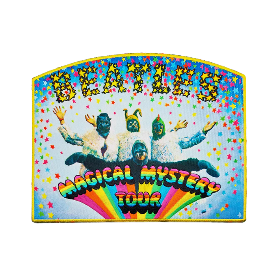 Colorful poster for The Beatles' 'Magical Mystery Tour' with four band members and rainbow design.