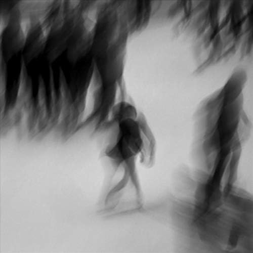 Black and white abstract art with blurred figures and shapes