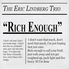 Album cover for 'Rich Enough' by The Eric Lindberg Trio with text and design elements.