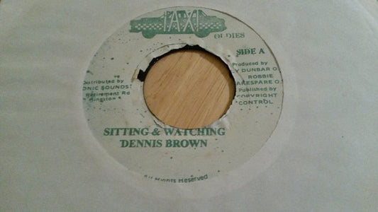 Dennis Brown : Sitting & Watching / Revolution (7", Single, Gre)