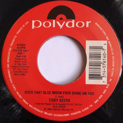 Toby Keith : Does That Blue Moon Ever Shine On You / She's Gonna Get It (7", Single)