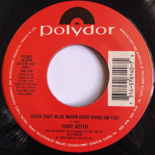 Toby Keith : Does That Blue Moon Ever Shine On You / She's Gonna Get It (7", Single)