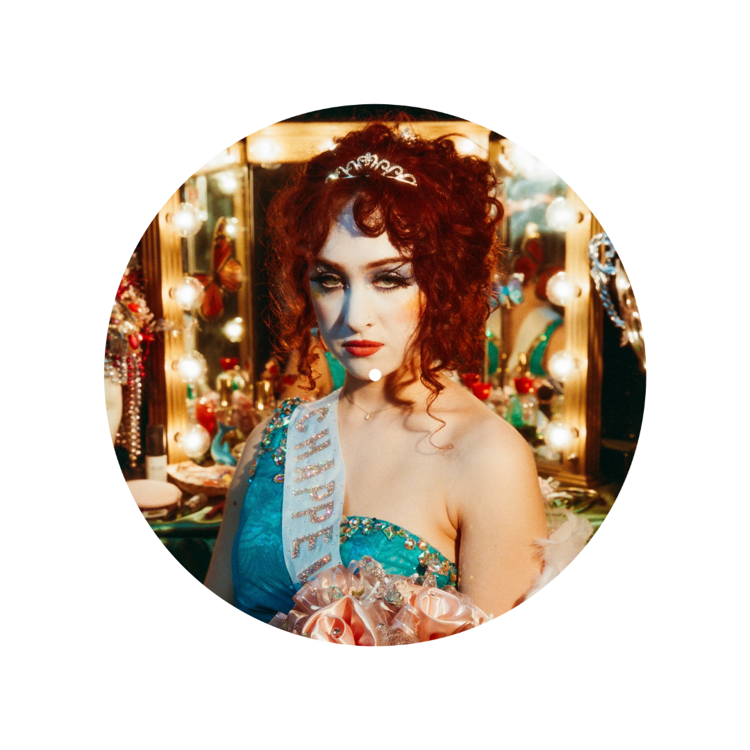 Woman in a festive setting with lights and decorations