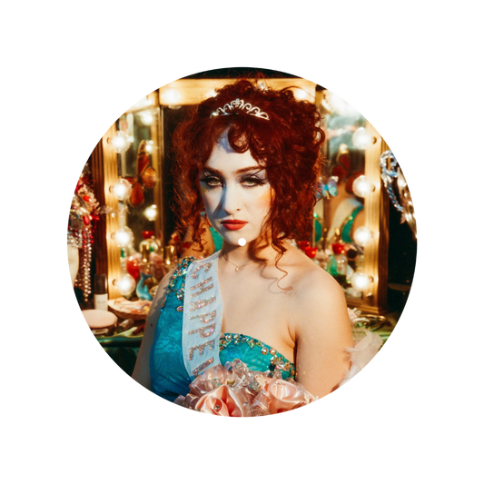 Woman in a festive setting with lights and decorations