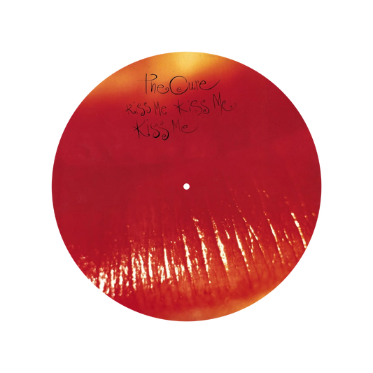 Red vinyl record with 'The Cure' and 'Kiss Me' text on a white background