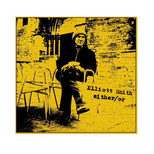 Image of a person sitting on a chair, featuring the text 'Elliott Smith either/or'.