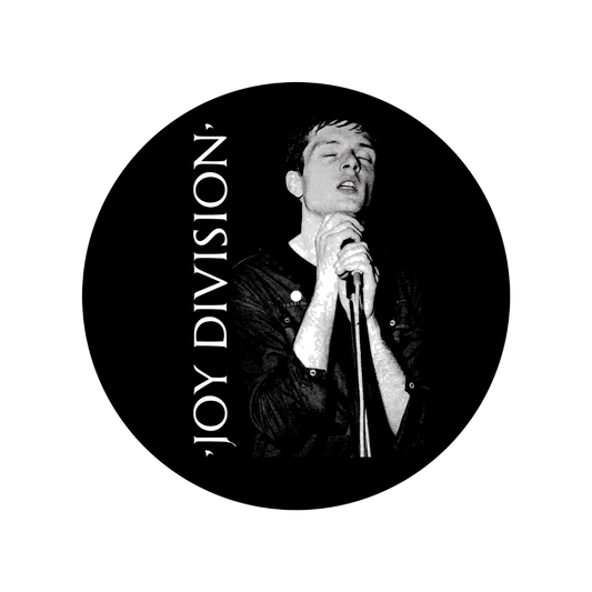 Black and white circular image with a person holding a microphone and 'Joy Division' text.