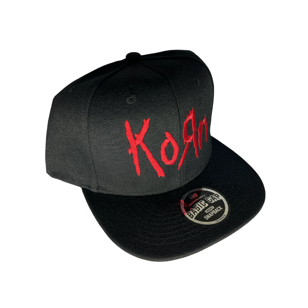 Black cap with red text 'Korn' on a white background