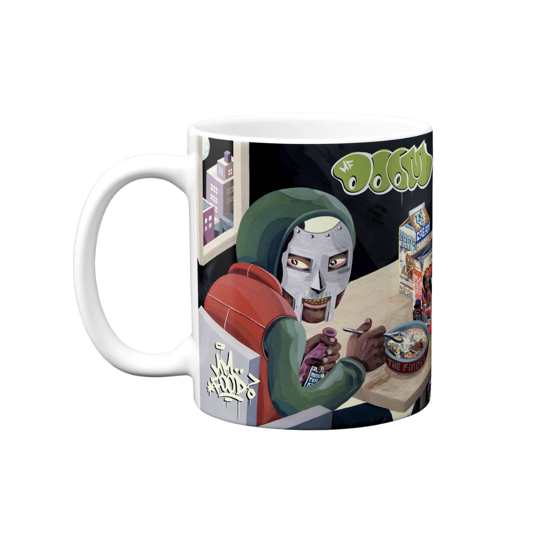 Mug with a graphic design of a character sitting at a table with a bowl and a can, on a white background.