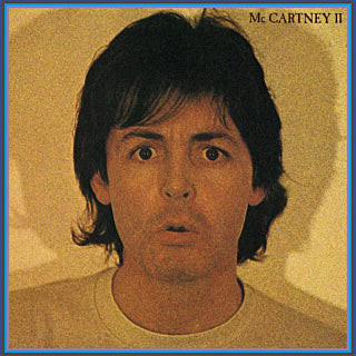 Album cover with a person's face and text 'McCartney II' on a textured background
