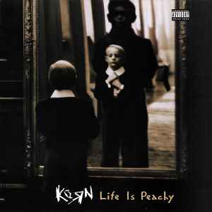 Korn Life is Peachy Album cover with kid in mirror. Parental Advisory label in topright corner. 