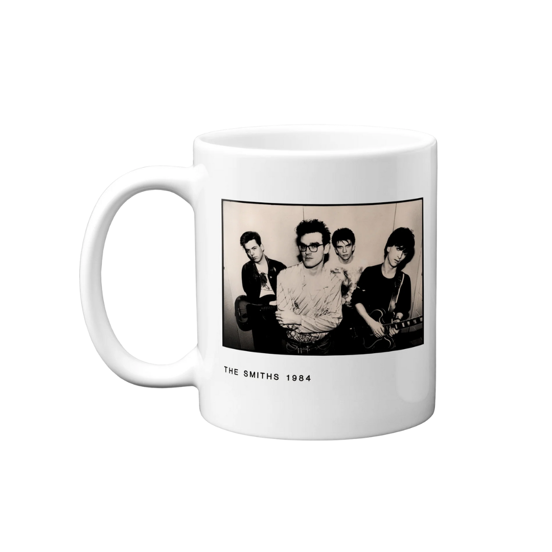 White mug with a black and white photo of a band on a white background