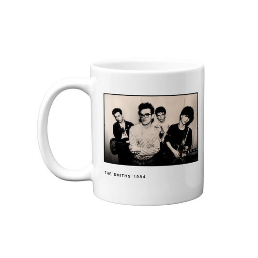 White mug with a black and white photo of a band on a white background