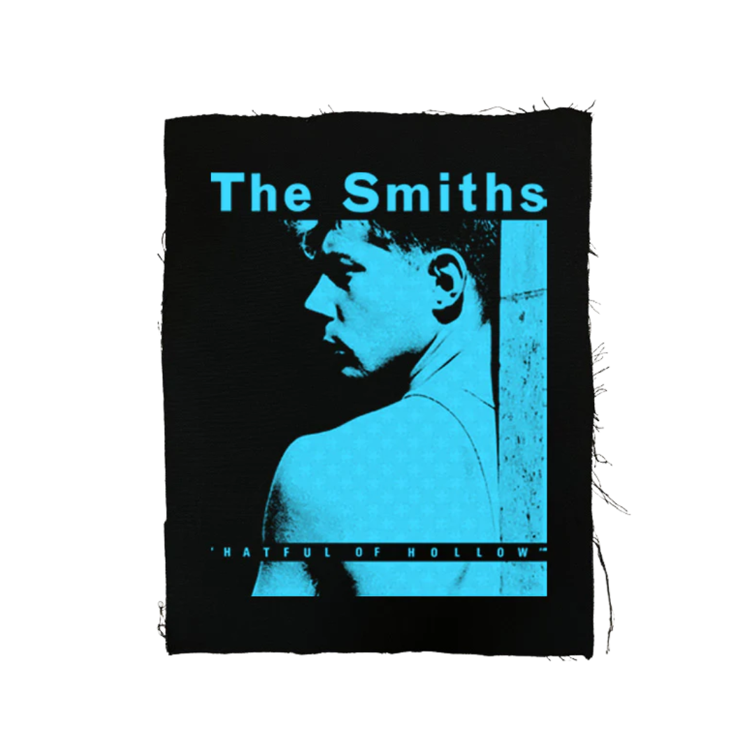 Album cover for 'The Smiths' featuring a silhouette of a person with text on a black background