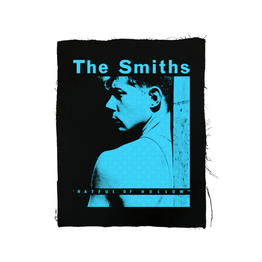 Album cover for 'The Smiths' featuring a silhouette of a person with text on a black background