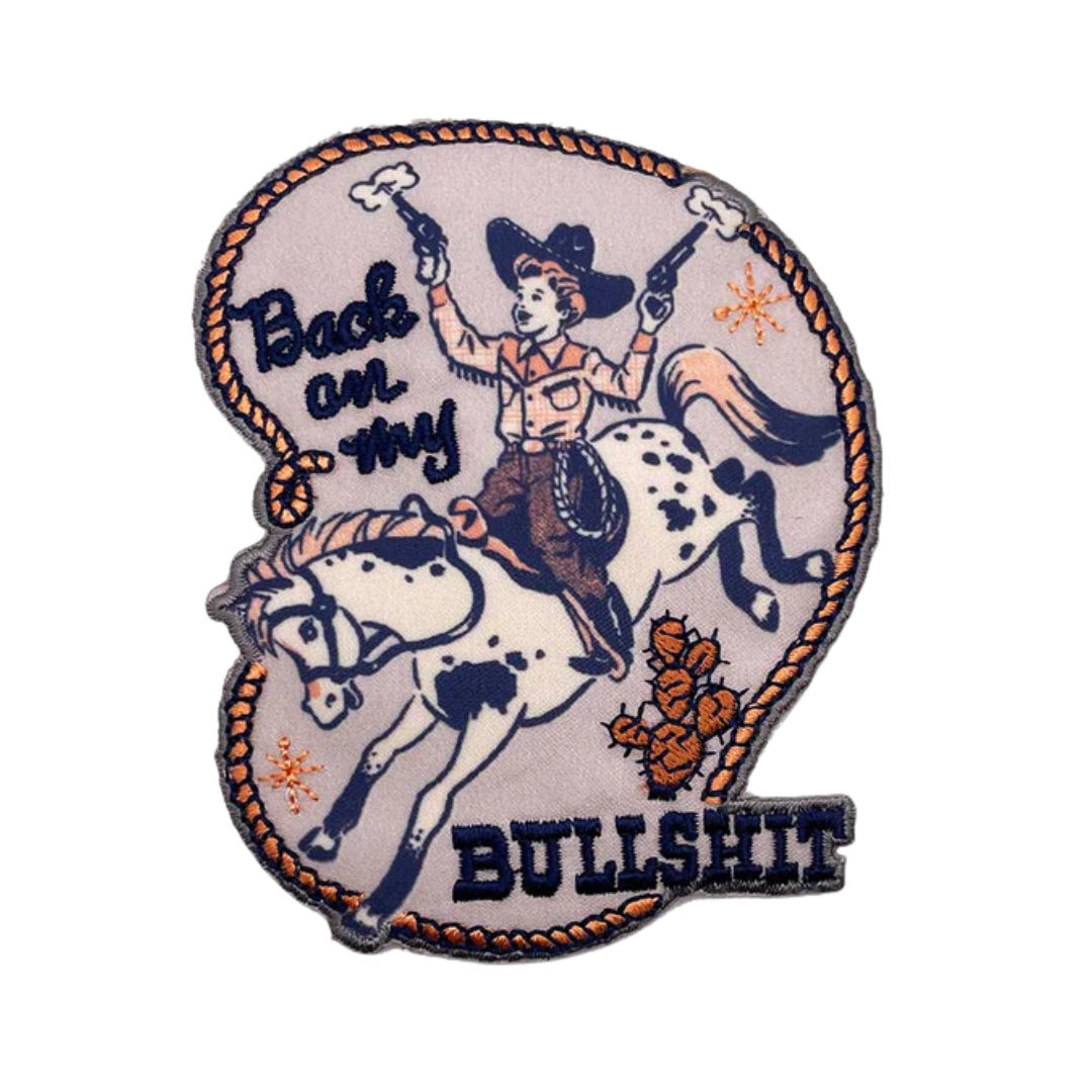 Patch with a cowboy riding a horse and text 'Back on my bullshit' on a white background