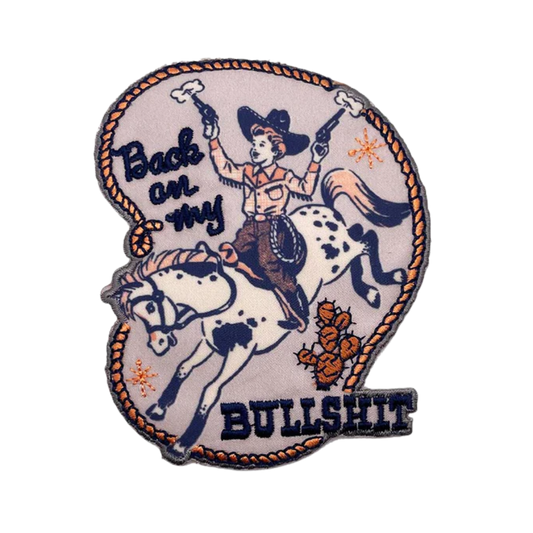 Patch with a cowboy riding a horse and text 'Back on my bullshit' on a white background