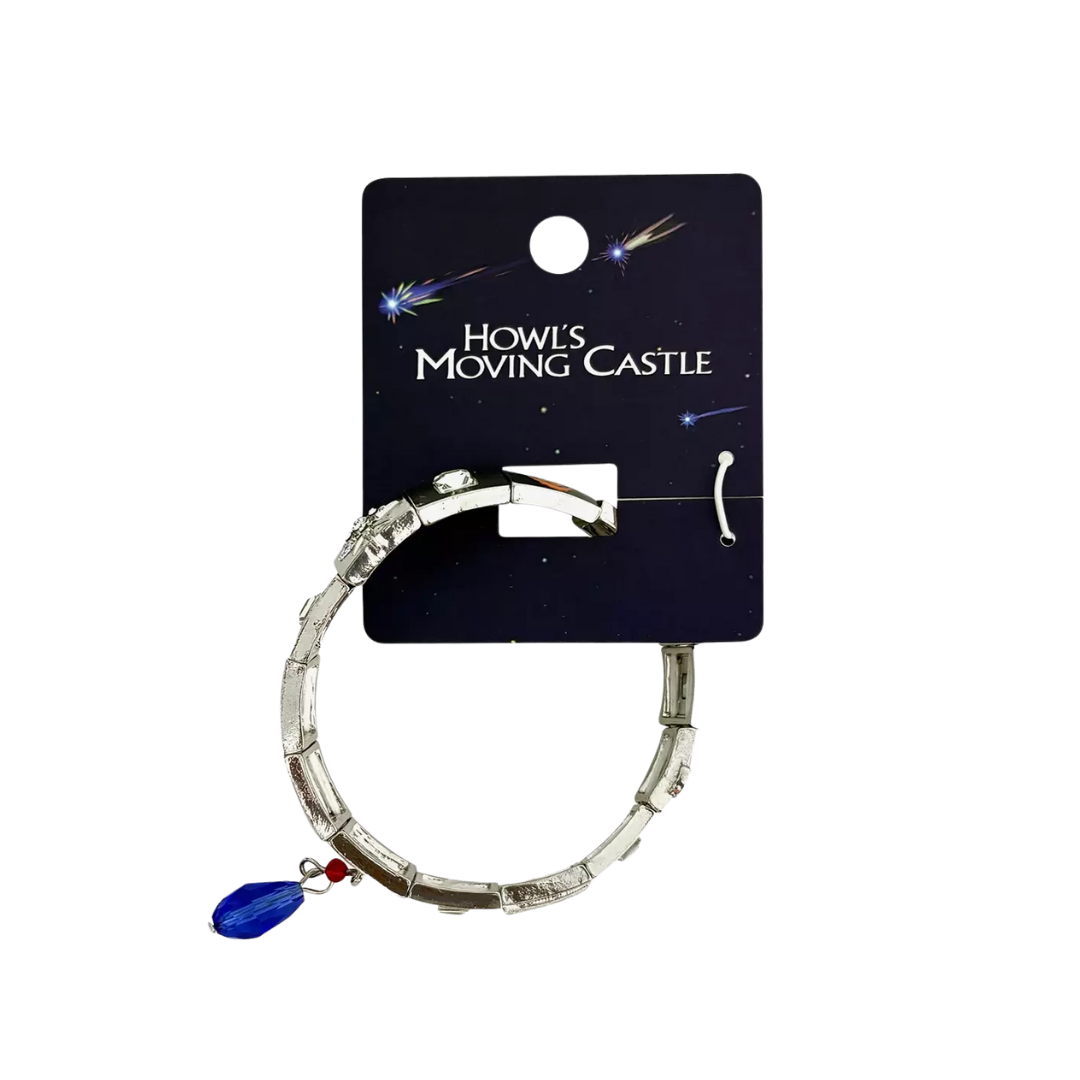 Bracelet with a blue and red charm on a 'Howl's Moving Castle' branded card