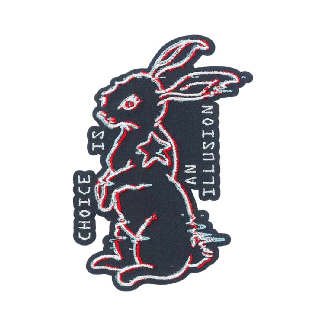 Embroidered patch of a rabbit with 'Choice is an Illusion' text on a white background