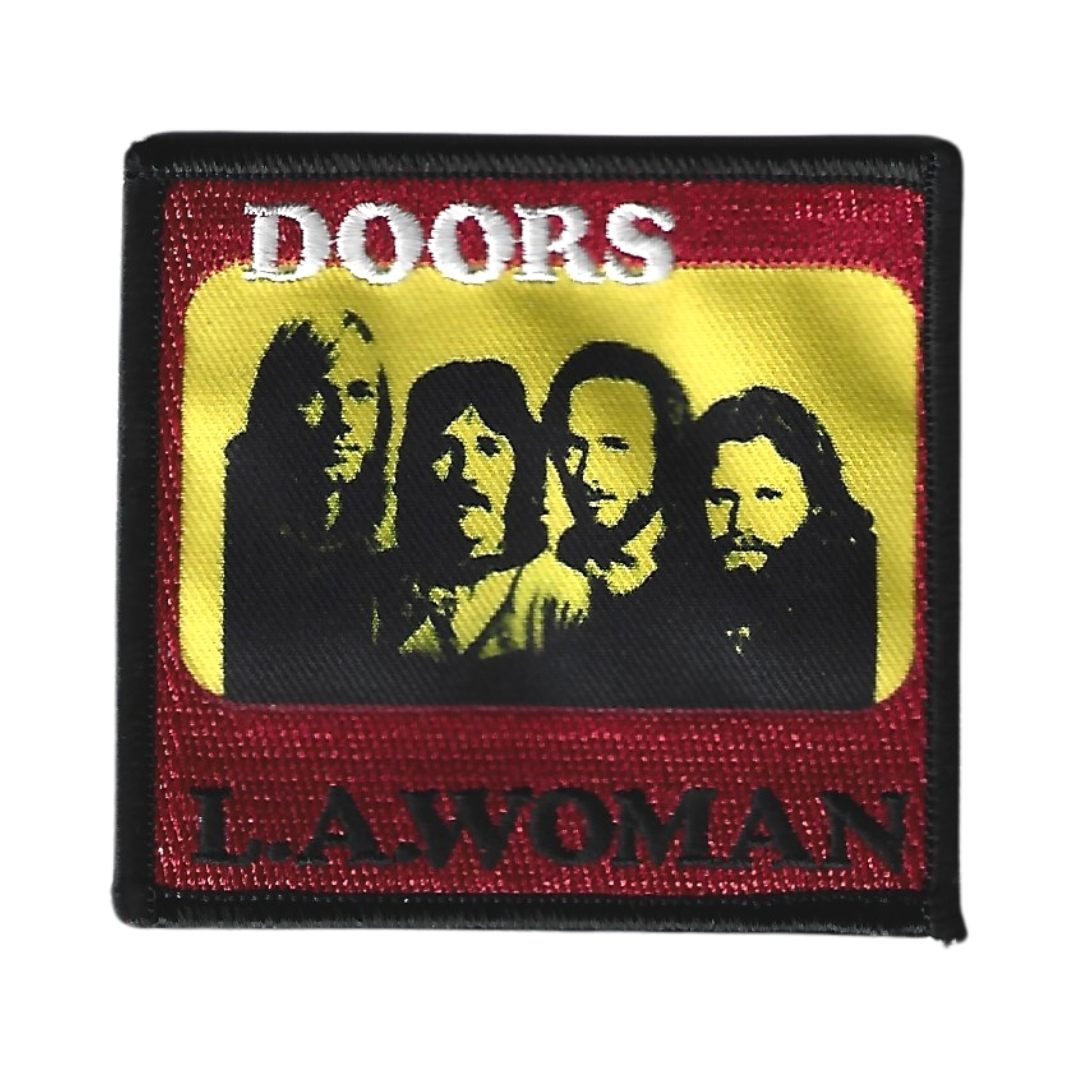 A patch featuring members of the band The Doors on a red background, with the text 'DOORS' and 'LA WOMAN' below their images.