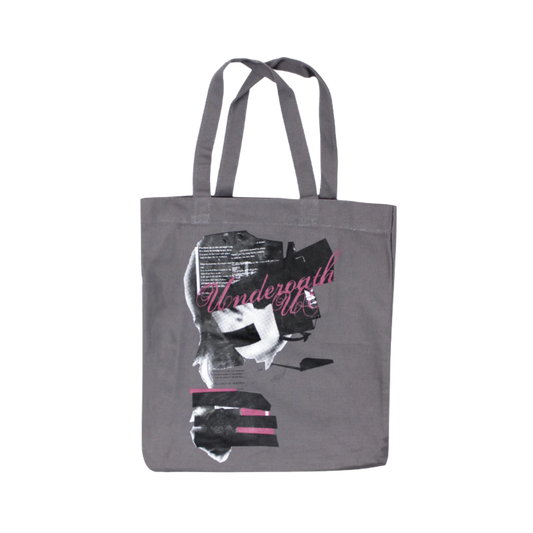 Gray tote bag with graphic design and text on a white background