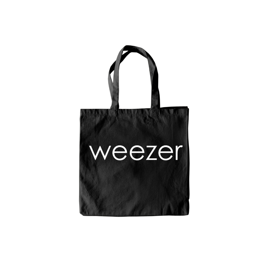 Black tote bag with 'weezer' logo on a white background