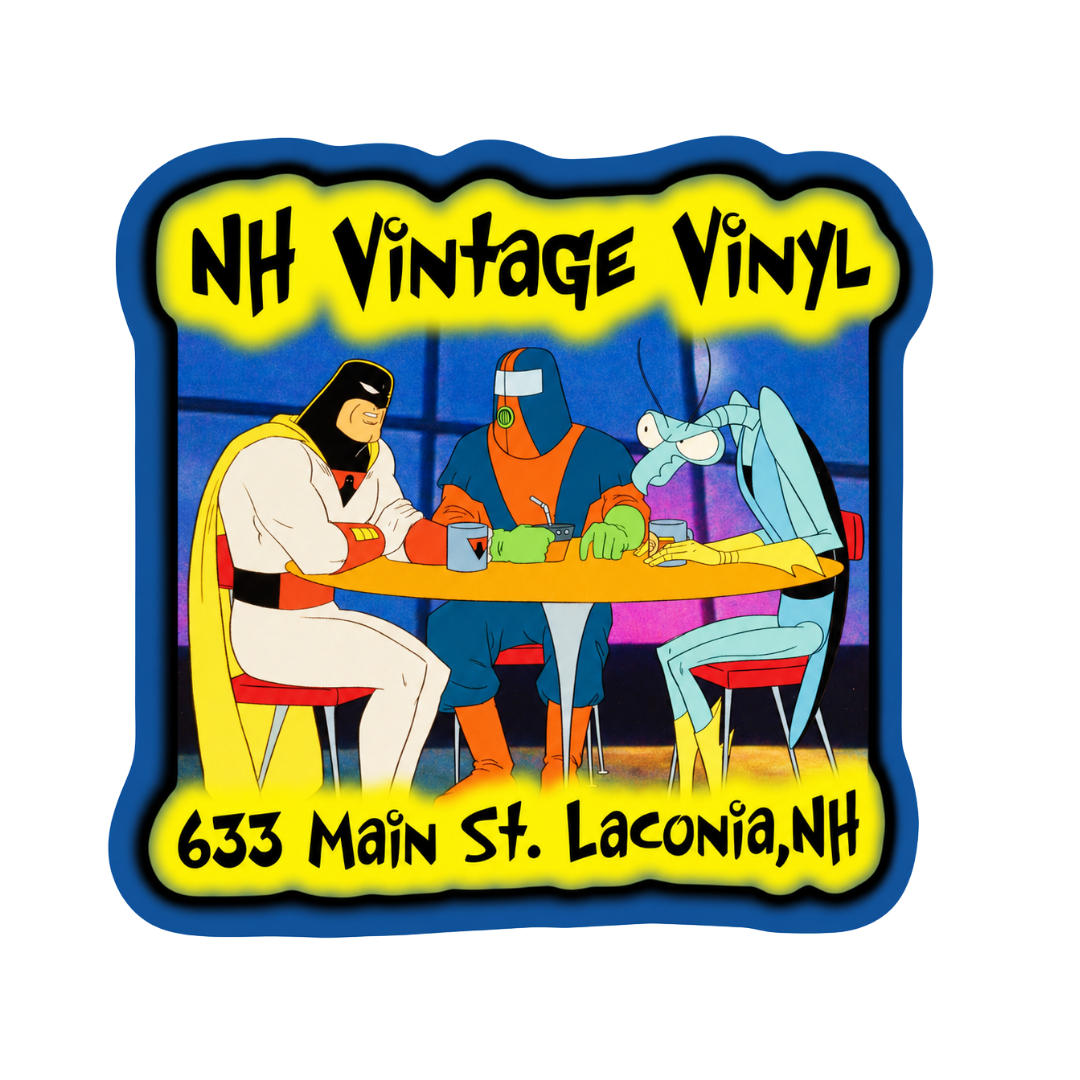A square vintage-style vinyl sticker or decal with a blue border, yellow background text reading 'NH Vintage Vinyl' and '633 Main St. Laconia, NH,' and a colorful cartoon scene of three masked figures seated around a table.